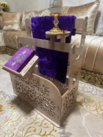 حامل السجادة و المصحف
